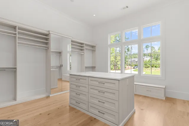 an aerial view of a house with garden space and street view
