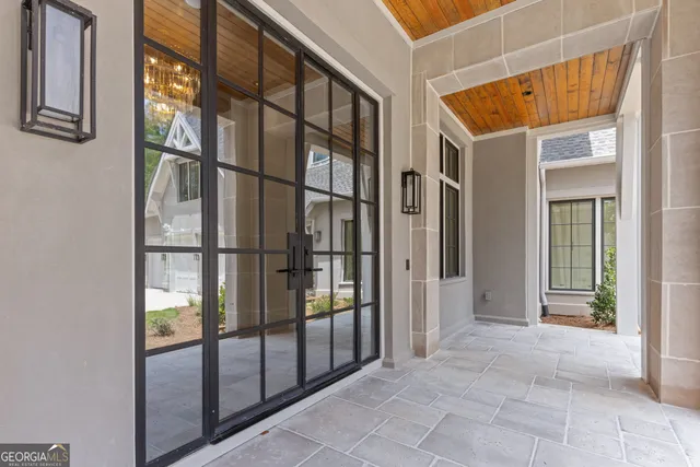 a kitchen with stainless steel appliances granite countertop a sink and a wooden floors