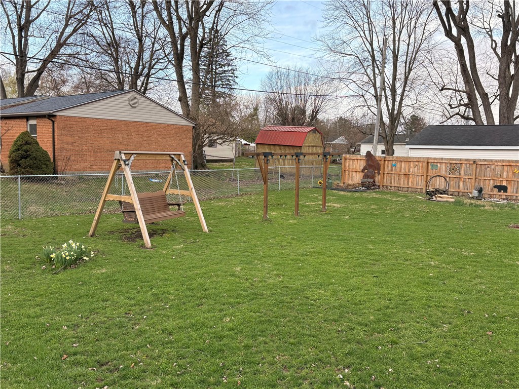 321 Liberty Street Eaton, OH 45320 - Photo 10 of 34 A spacious yard with lush green grass, perfect for outdoor recreation and relaxation.