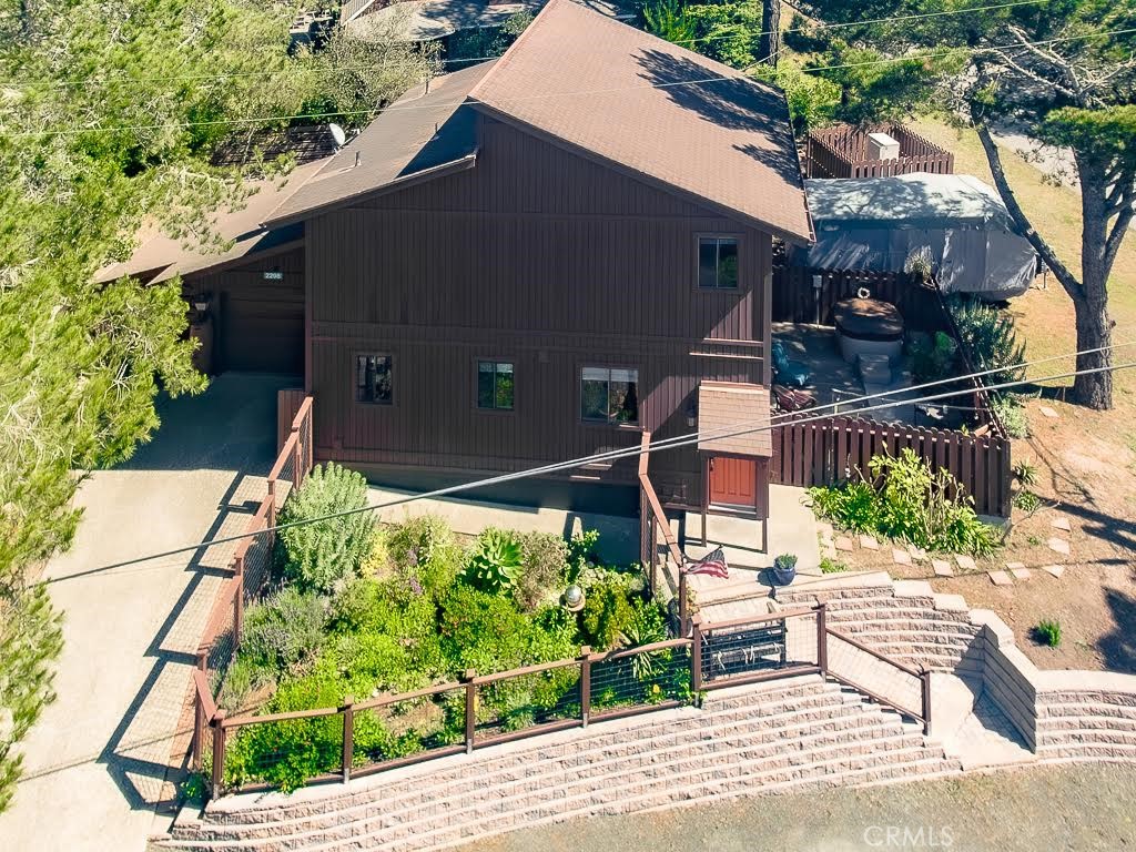 2298 Tipton Street Cambria, CA 93428 - Photo 1 of 54 a backyard of a house with outdoor seating