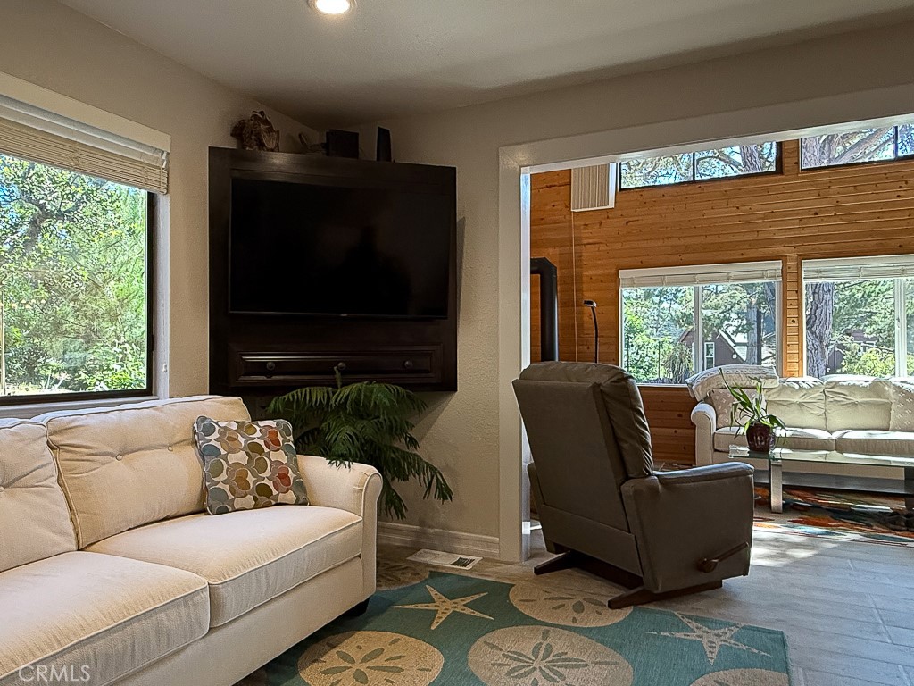 2298 Tipton Street Cambria, CA 93428 - Photo 20 of 54 a living room with furniture and a flat screen tv