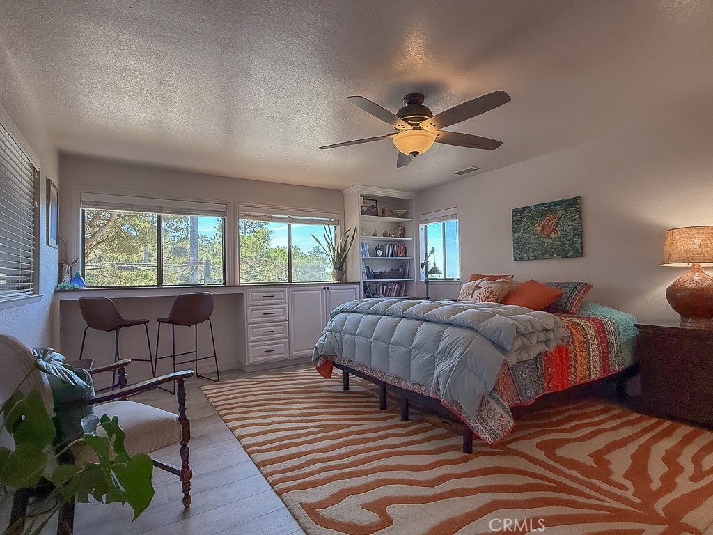 2298 Tipton Street Cambria, CA 93428 - Photo 27 of 54 a bedroom with a bed and a window