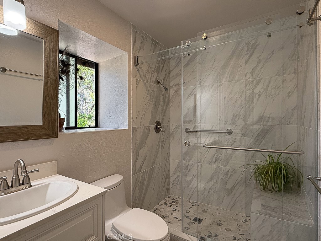 2298 Tipton Street Cambria, CA 93428 - Photo 32 of 54 a bathroom with a sink toilet and shower