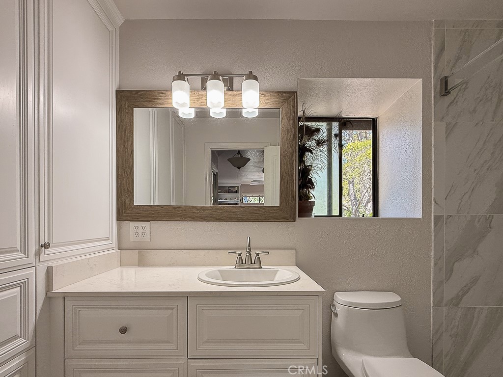 2298 Tipton Street Cambria, CA 93428 - Photo 33 of 54 a bathroom with a sink and a mirror