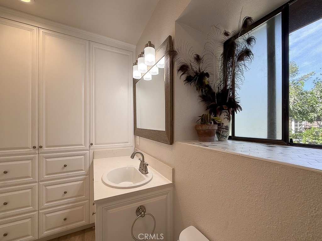 2298 Tipton Street Cambria, CA 93428 - Photo 34 of 54 a bathroom with a sink and a mirror