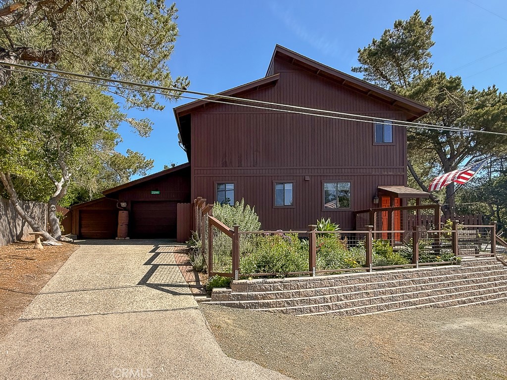 2298 Tipton Street Cambria, CA 93428 - Photo 40 of 54 a front view of a house with garden