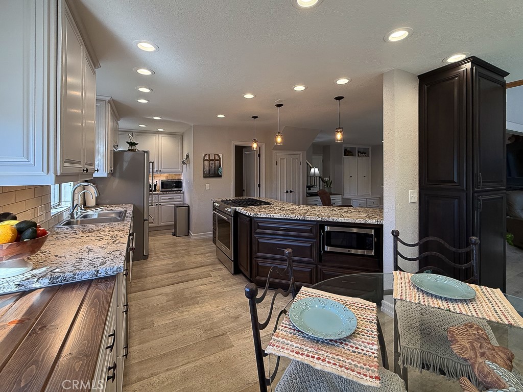 2298 Tipton Street Cambria, CA 93428 - Photo 9 of 54 a kitchen with a refrigerator sink and cabinets