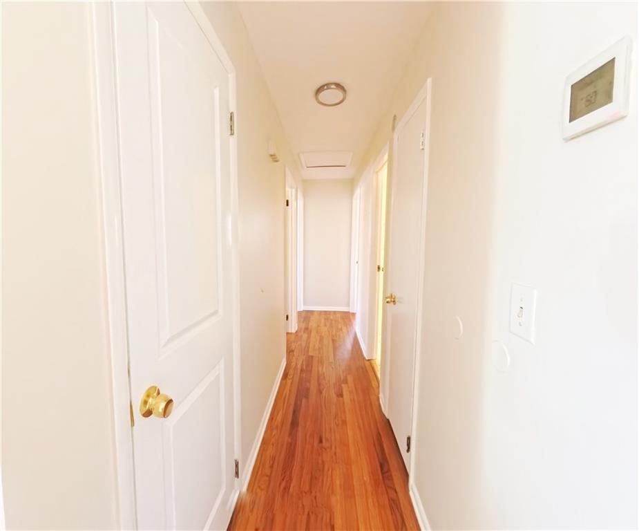 3881 Pin Oak Circle Atlanta, GA 30340 - Photo 15 of 26 a view of a hallway with wooden floor