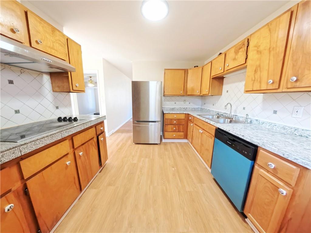 3881 Pin Oak Circle Atlanta, GA 30340 - Photo 21 of 26 a kitchen with stainless steel appliances granite countertop a sink stove and refrigerator