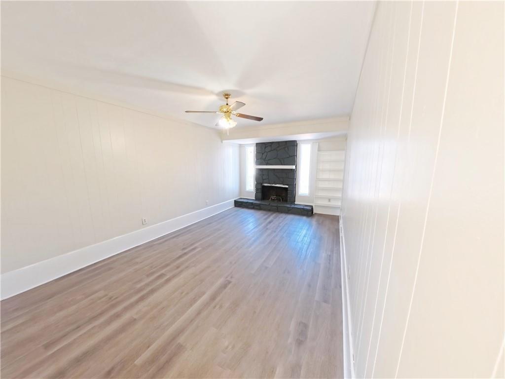 3881 Pin Oak Circle Atlanta, GA 30340 - Photo 22 of 26 a view of an empty room with wooden floor