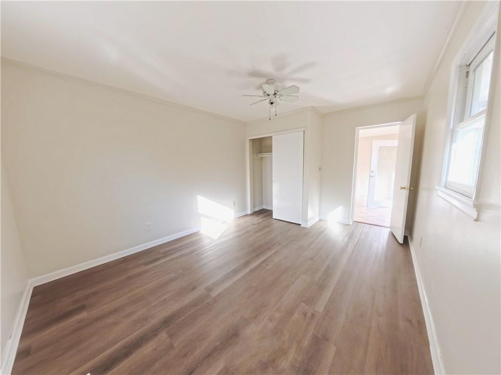 3881 Pin Oak Circle Atlanta, GA 30340 - Photo 25 of 26 wooden floor in an empty room with a window