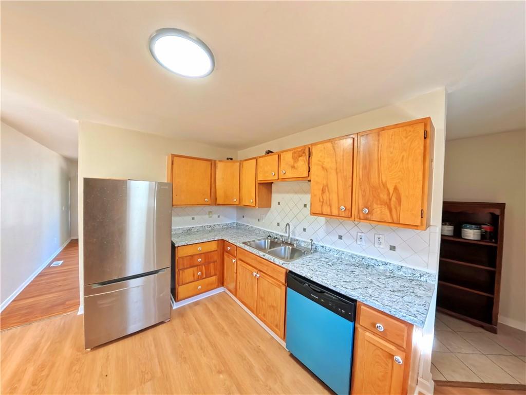 3881 Pin Oak Circle Atlanta, GA 30340 - Photo 5 of 26 a kitchen with stainless steel appliances granite countertop a refrigerator and a sink