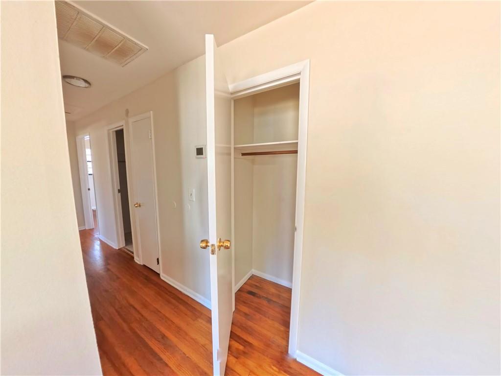 3881 Pin Oak Circle Atlanta, GA 30340 - Photo 6 of 26 a view of a hallway with wooden floor and staircase