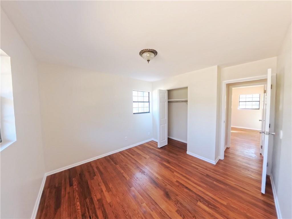 3881 Pin Oak Circle Atlanta, GA 30340 - Photo 10 of 26 a view of an empty room with window and wooden floor