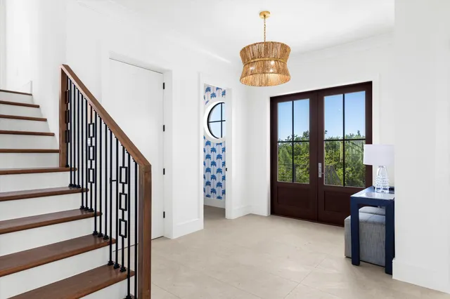 a view of entryway and hall with wooden floor