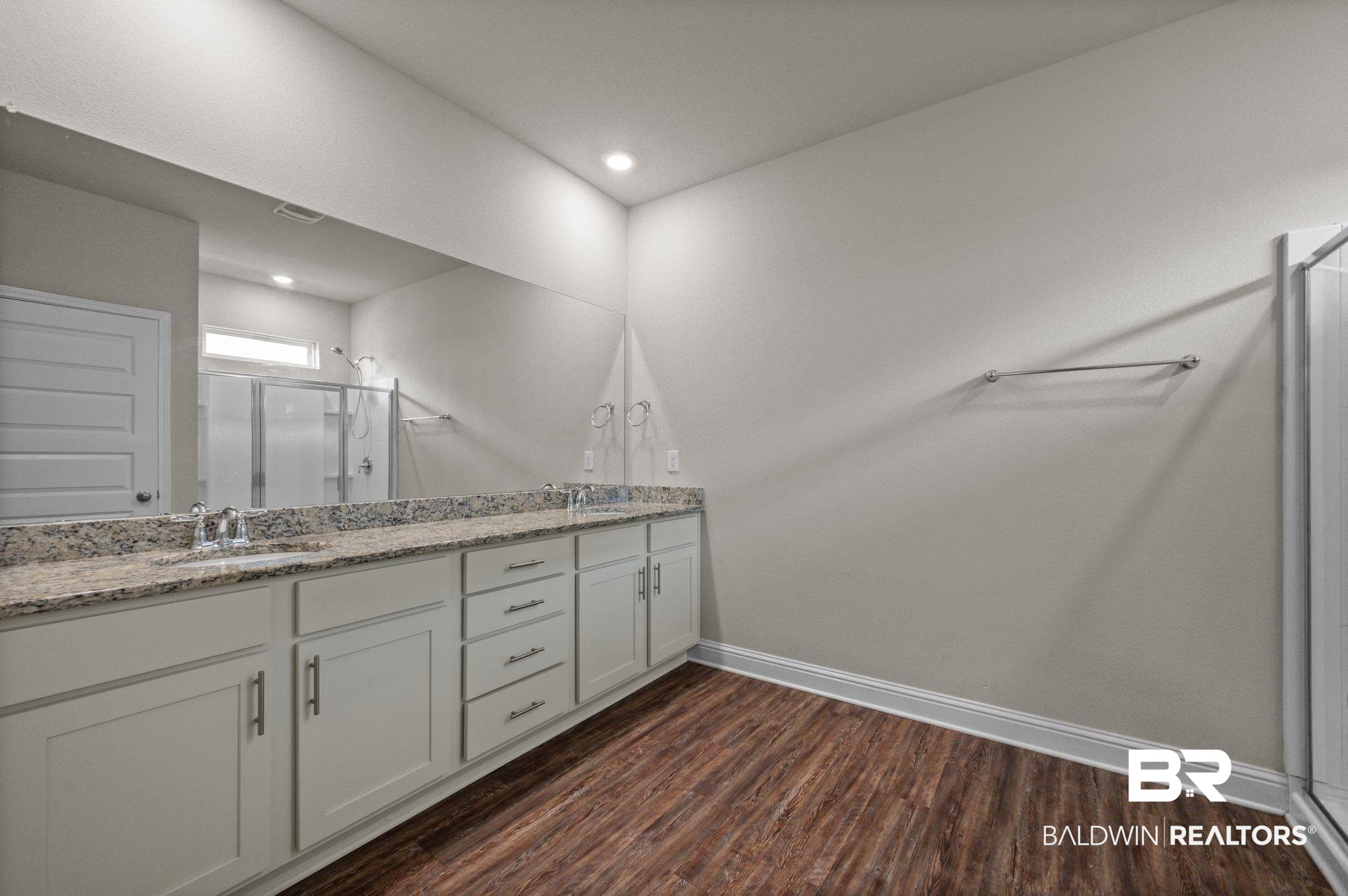 24769 Slater Mill Road Daphne, AL 36526 - Photo 21 of 38 Bathroom featuring hardwood / wood-style floors, a shower with door, and double vanity