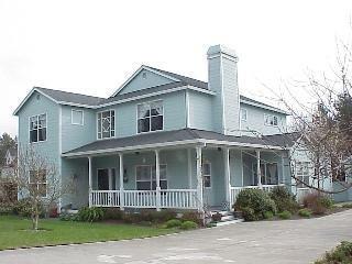 8151 Ragle Place Sebastopol, CA 95472 - Photo 1 of 11 a front view of a house with a garden