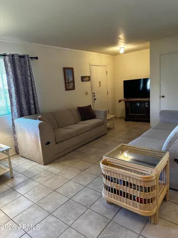 a bedroom with a bed and a lamp