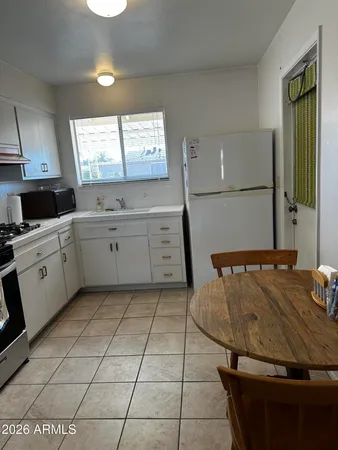 a kitchen with a stove and a cabinets