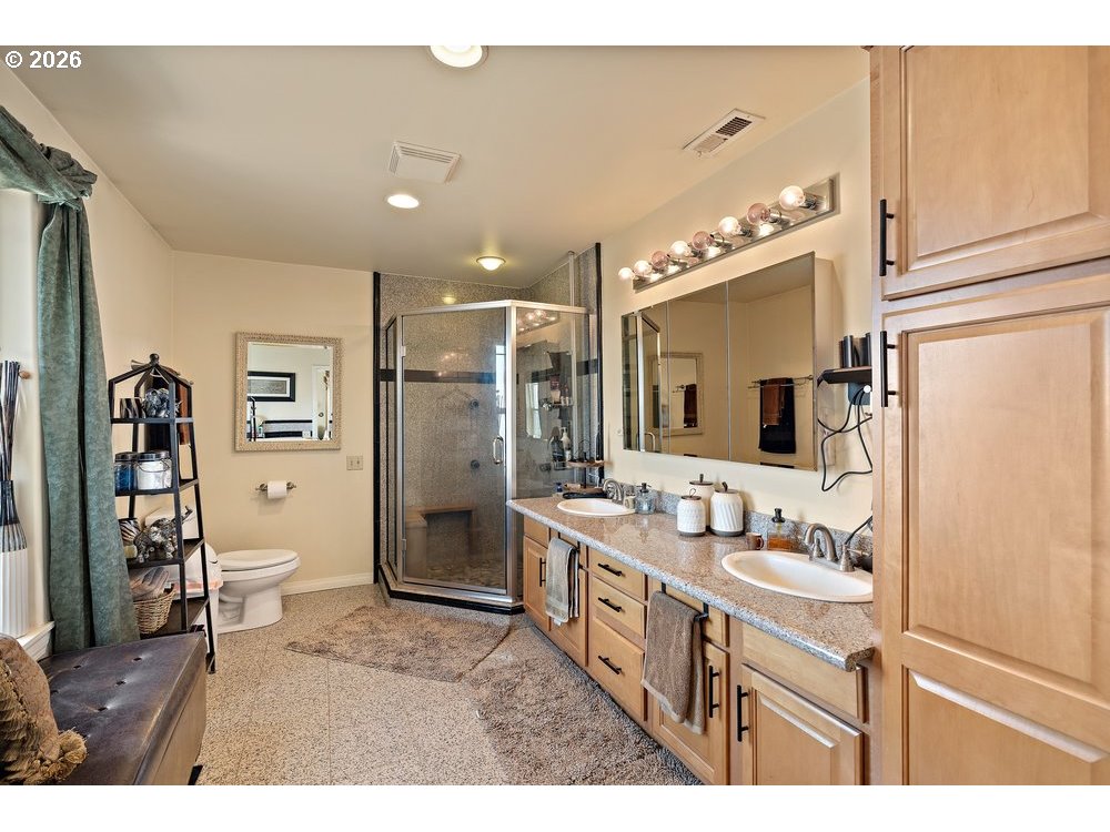 500 St Hilaire Road Yakima, WA 98901 - Photo 11 of 29 a bathroom with a sink a toilet and shower