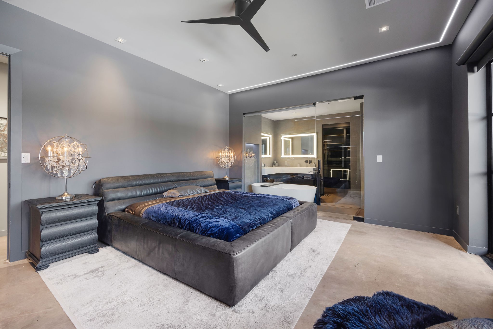 908 White Street Houston, TX 77007 - Photo 11 of 21 Primary bedroom with modern finishes, recessed lighting, and direct access to a spa-inspired bathroom.