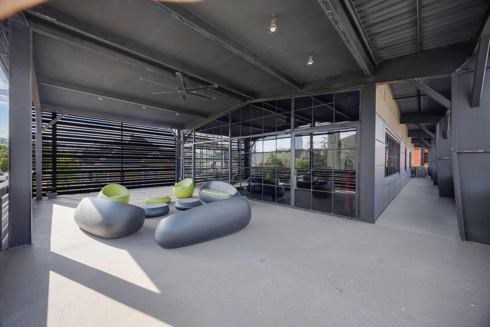 908 White Street Houston, TX 77007 - Photo 18 of 21 Alternate view of the rooftop terrace showcasing spacious layout, shaded seating area, and seamless indoor-outdoor flow.