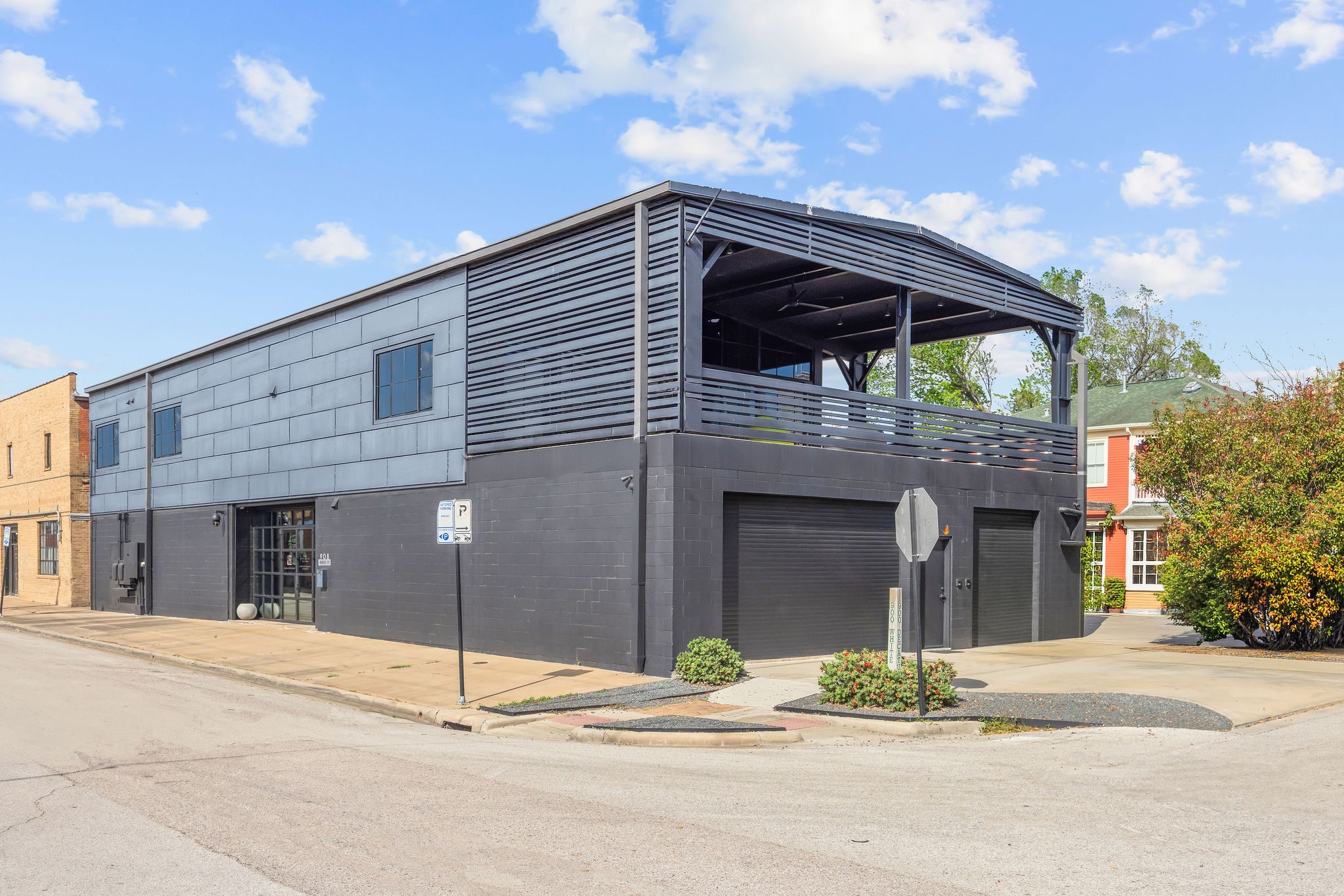 908 White Street Houston, TX 77007 - Photo 21 of 21 Contemporary two-story building with modern industrial exterior and corner positioning.The upstairs unit is the one available for lease.