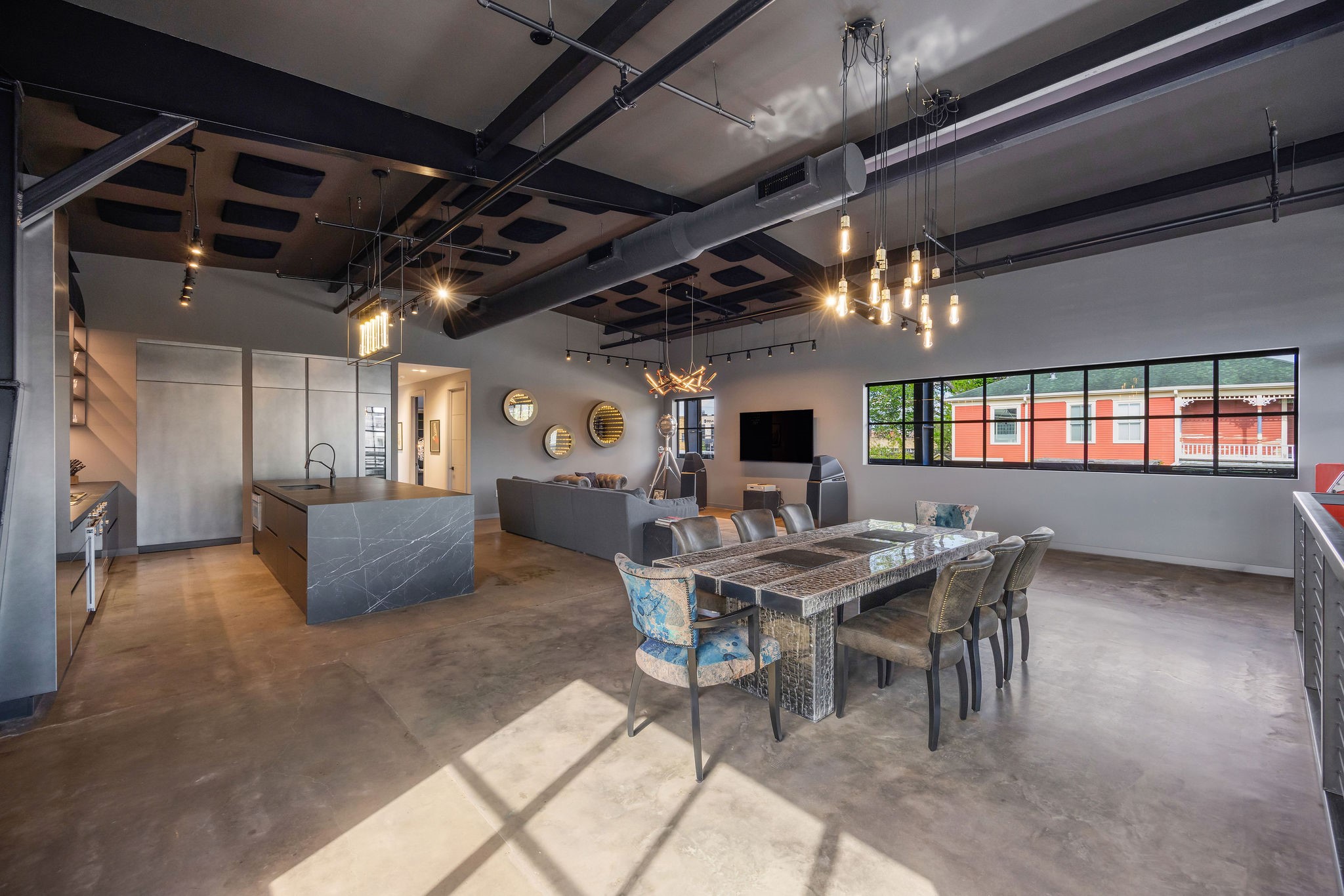 908 White Street Houston, TX 77007 - Photo 4 of 21 Open-concept living, dining, and kitchen area featuring high ceilings, exposed ductwork, and polished concrete floors.