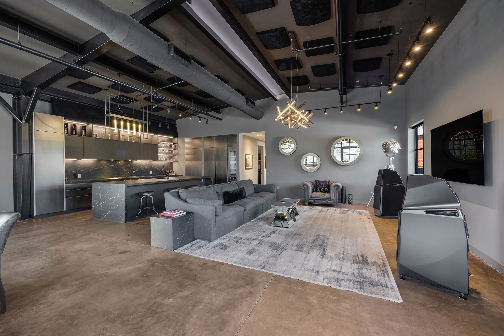 908 White Street Houston, TX 77007 - Photo 6 of 21 Spacious living area with modern lighting fixtures, integrated kitchen, and contemporary finishes throughout.