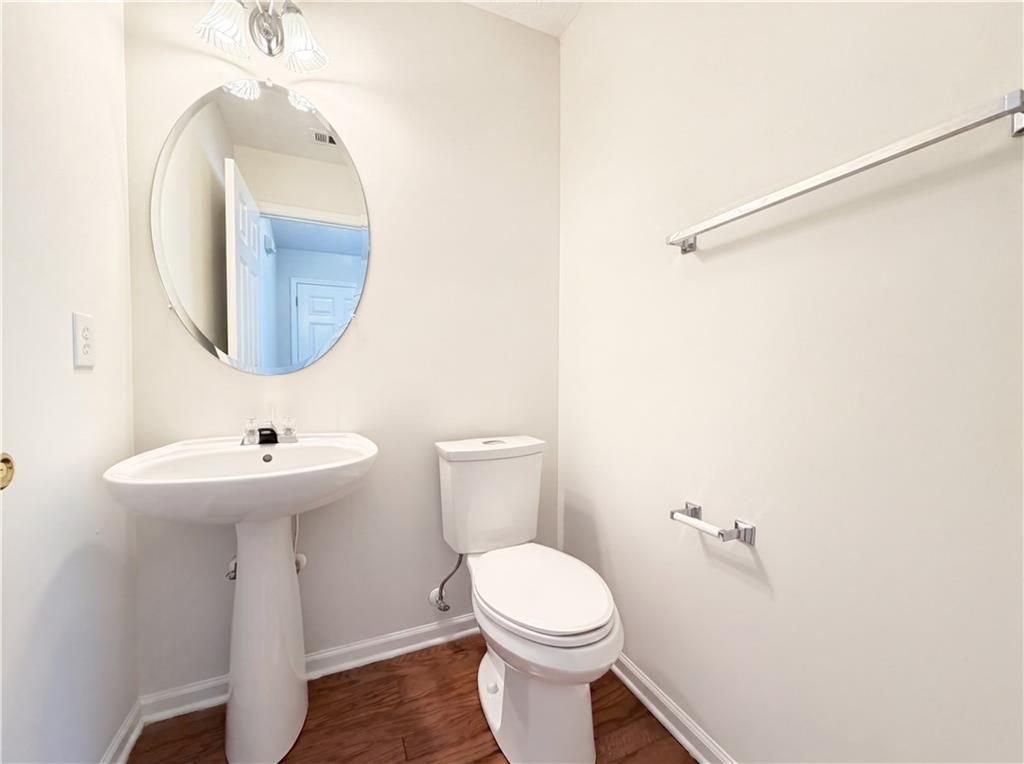 503 Oakleaf Court Acworth, GA 30102 - Photo 11 of 17 a bathroom with a sink a toilet and mirror