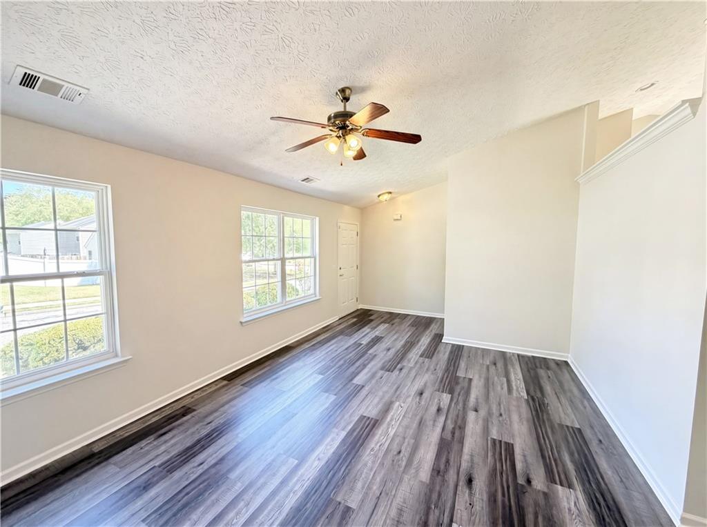503 Oakleaf Court Acworth, GA 30102 - Photo 3 of 17 wooden floor in an empty room with a window