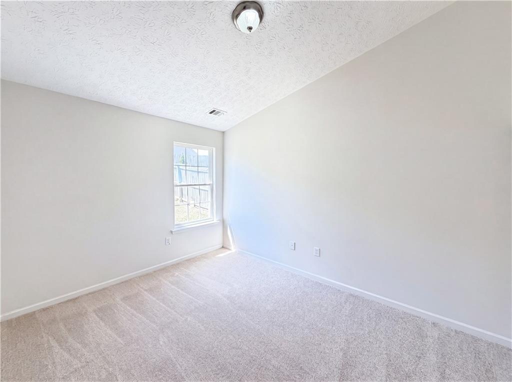 503 Oakleaf Court Acworth, GA 30102 - Photo 8 of 17 a view of an empty room with a window