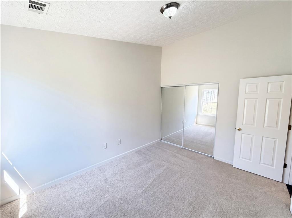 503 Oakleaf Court Acworth, GA 30102 - Photo 9 of 17 an empty room with windows