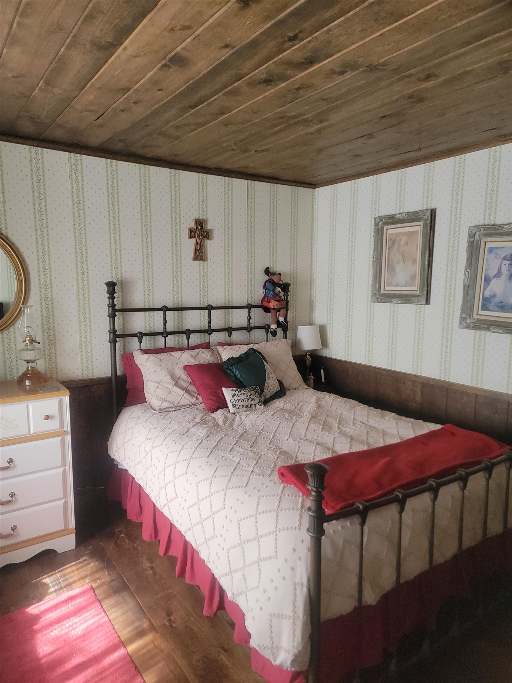 11702 Twin Lakes Road Bridgeport, CA 93517 - Photo 12 of 21 Wood-finish plank ceiling and flooring frame this bedroom space