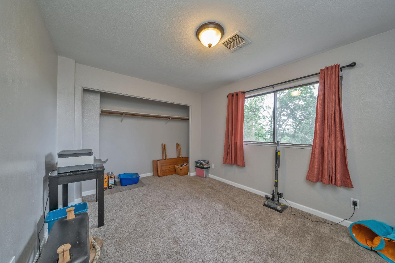 3041 Rising Hill Court Placerville, CA 95667 - Photo 28 of 31 a view of a room with gym equipment and windows