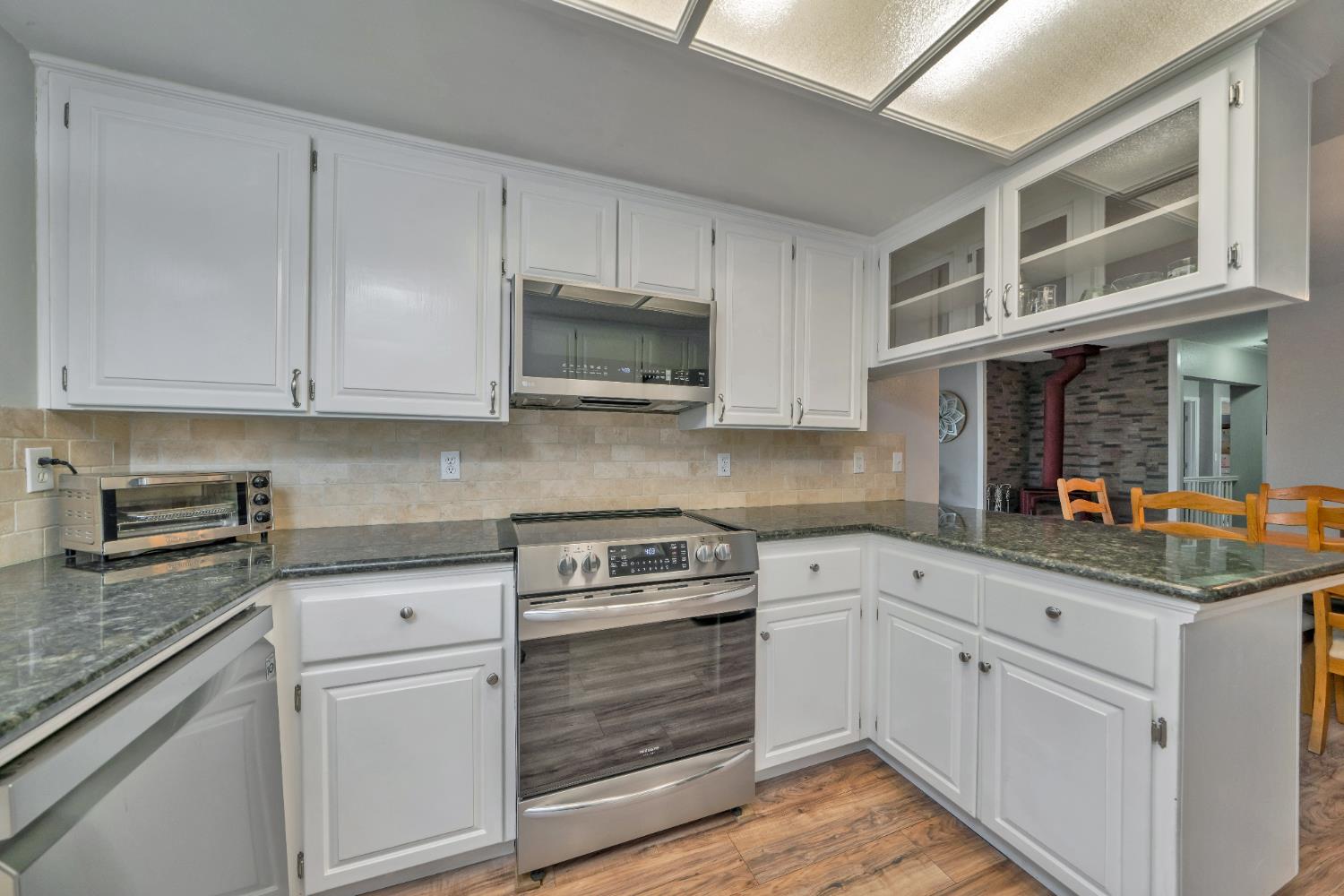3041 Rising Hill Court Placerville, CA 95667 - Photo 31 of 31 a kitchen with stainless steel appliances granite countertop a sink and cabinets