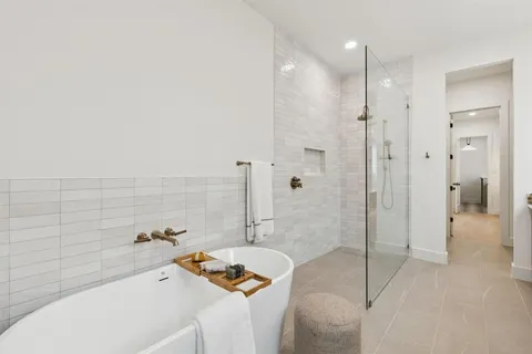 a bathroom with a tub and a sink