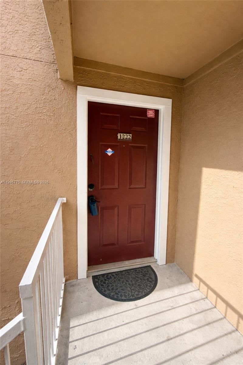 10581 Southwest 155th Court, Unit 1222 Miami, FL 33196 - Photo 1 of 15 a view of a wooden door