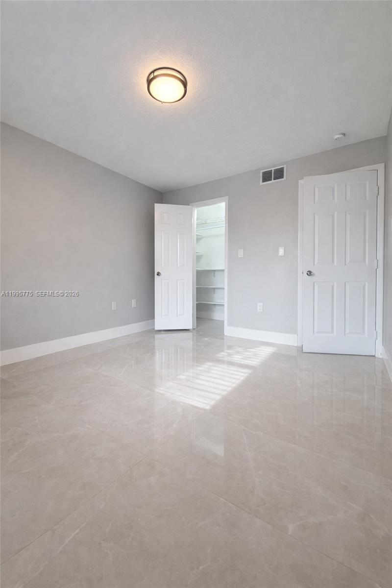 10581 Southwest 155th Court, Unit 1222 Miami, FL 33196 - Photo 11 of 15 a view of empty room