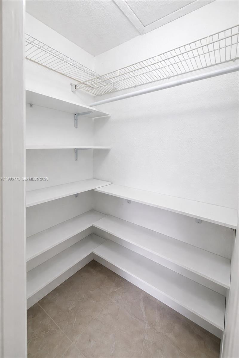 10581 Southwest 155th Court, Unit 1222 Miami, FL 33196 - Photo 12 of 15 a refrigerator in a kitchen