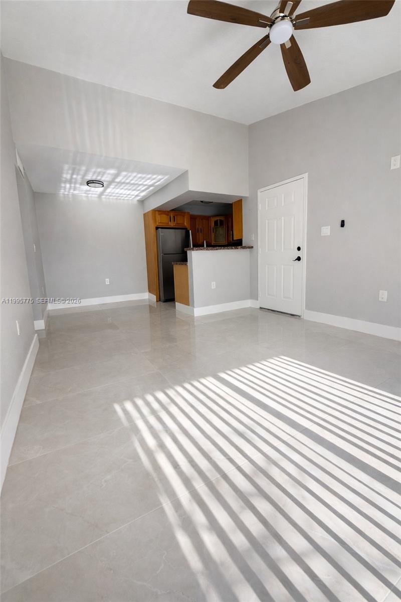 10581 Southwest 155th Court, Unit 1222 Miami, FL 33196 - Photo 6 of 15 a view of a livingroom with a fireplace