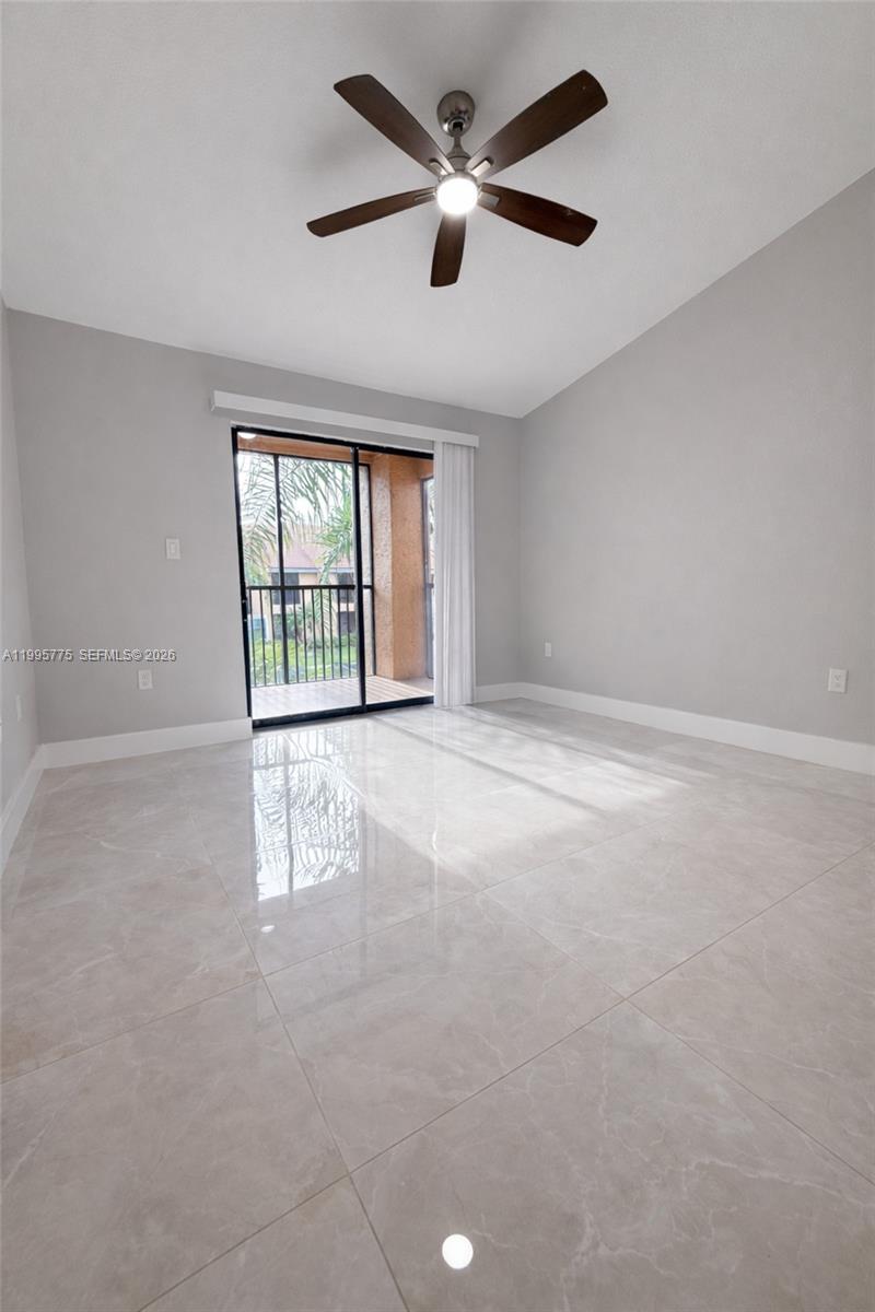 10581 Southwest 155th Court, Unit 1222 Miami, FL 33196 - Photo 7 of 15 a view of an empty room with a window