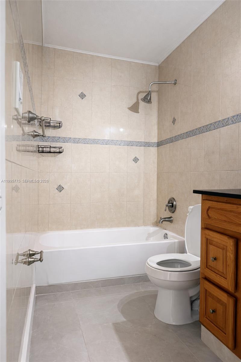 10581 Southwest 155th Court, Unit 1222 Miami, FL 33196 - Photo 9 of 15 a bathroom with a toilet and a bathtub