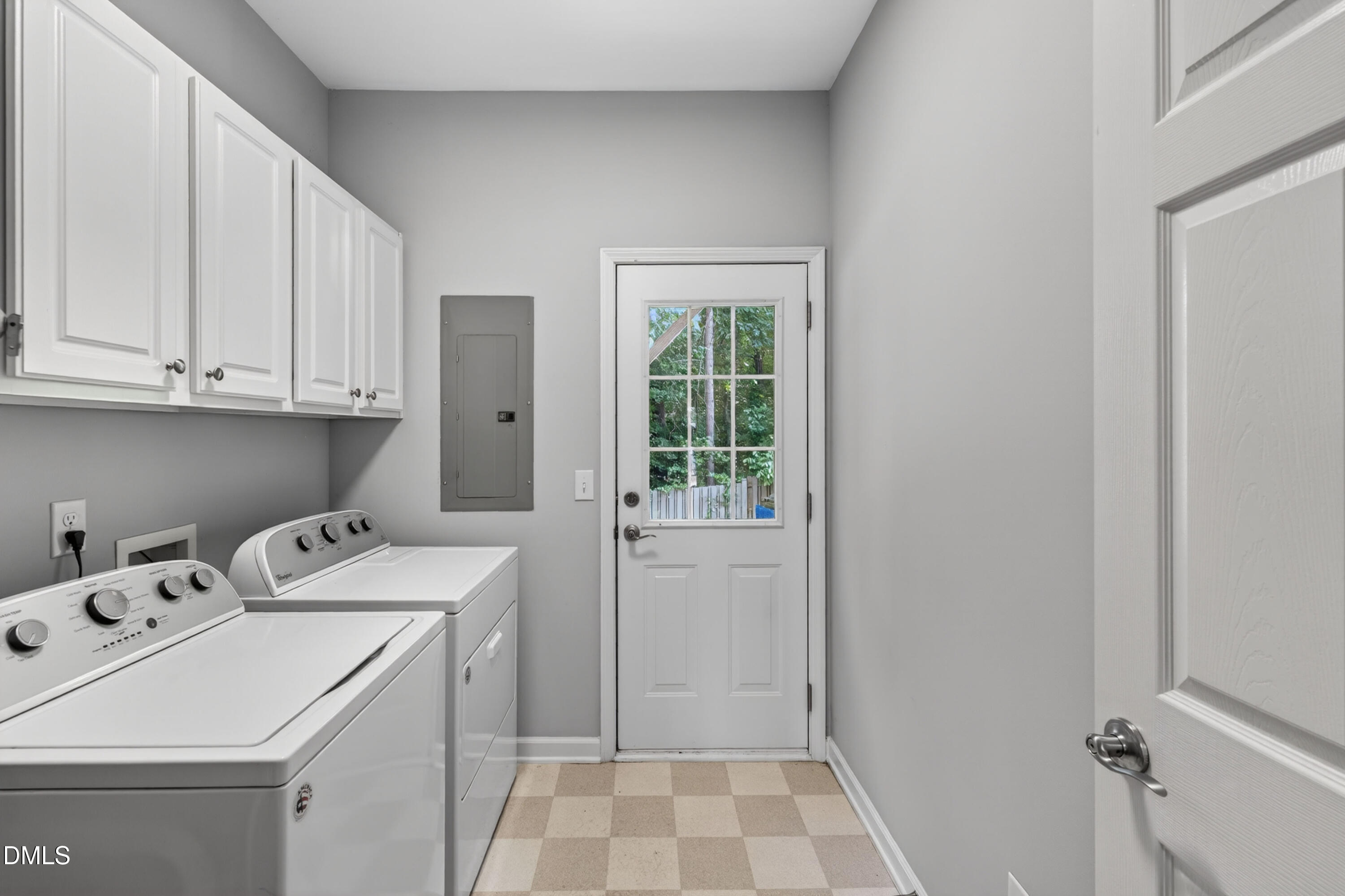 5421 Golden Arrow Lane Raleigh, NC 27613 - Photo 12 of 49 a utility room with dryer and washer