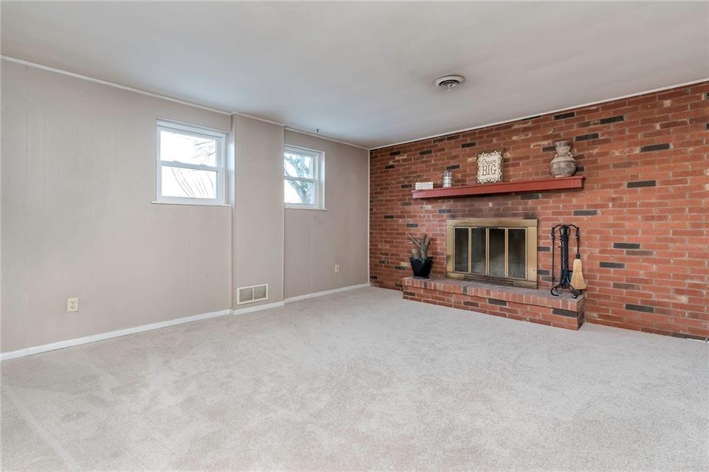 442 Sharon Road Coraopolis, PA 15108 - Photo 14 of 25 Wood fireplace in the family room, perfect to cozy up to on those cold winter nights.