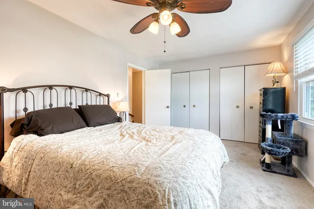 a bed room with a bed and a chandelier