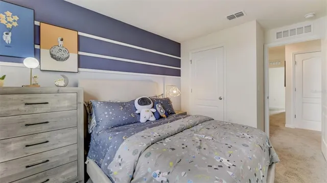 a view of a swimming pool with outdoor seating and lake view