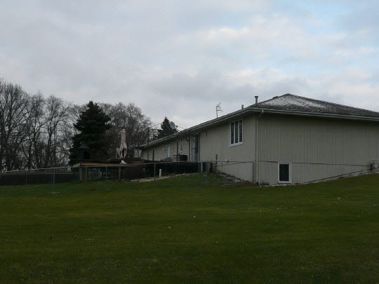 5712 Gray Eagle Road Roscoe, IL 61073 - Photo 3 of 10 a backyard of a house with lots of green space and trampoline