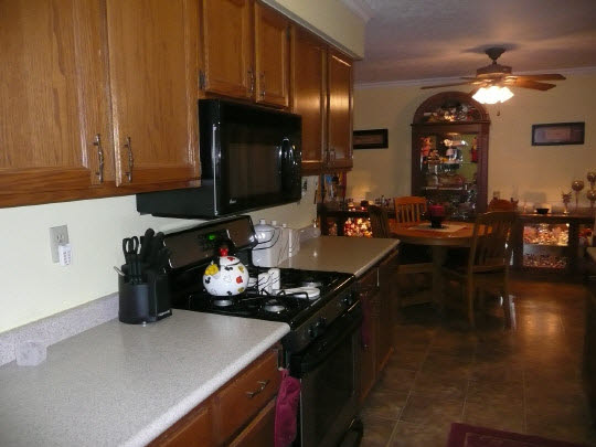5712 Gray Eagle Road Roscoe, IL 61073 - Photo 4 of 10 a kitchen with a sink appliances and cabinets