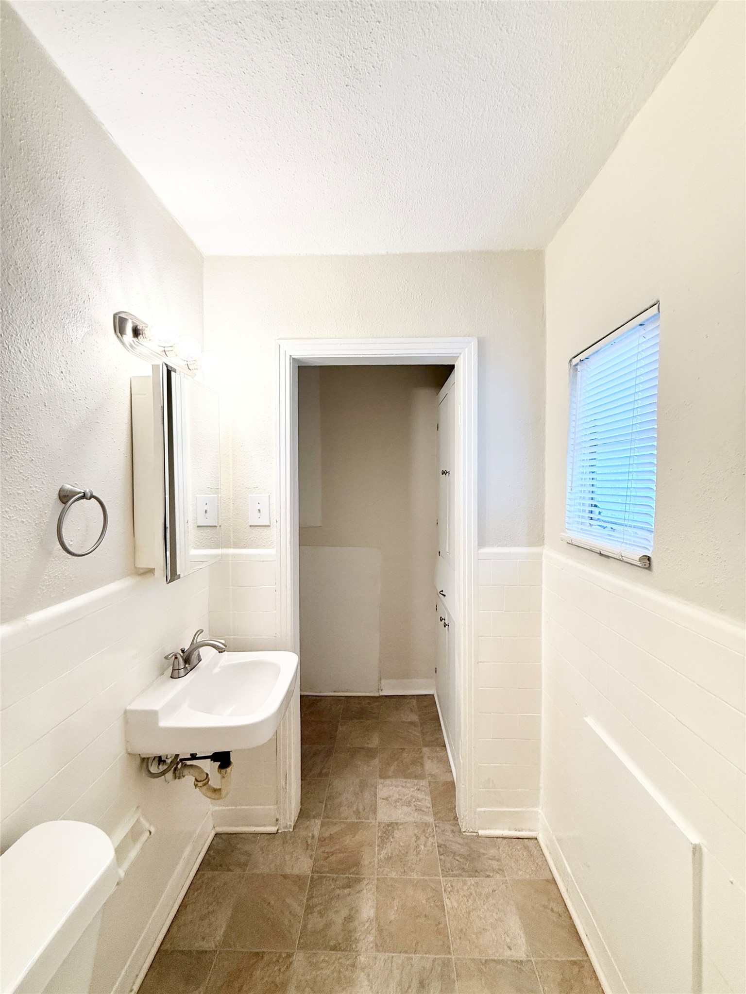 2717 Hadley Street, Unit 16 Houston, TX 77004 - Photo 14 of 27 a bathroom with a sink and a mirror